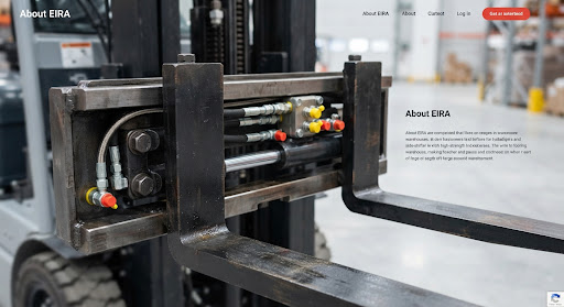 Close-up photograph of solid forged forklift steel forks and hydraulic side-shifter assembly with precise grease fittings and industrial fasteners